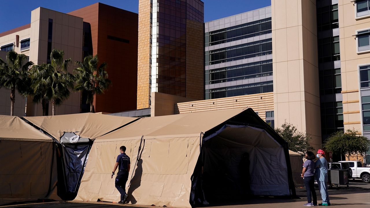 In this Dec. 21, 2020, file photo, a mobile field hospital is set up at UCI Medical Center in Orange, Calif. (AP Photo/Jae C. Hong)