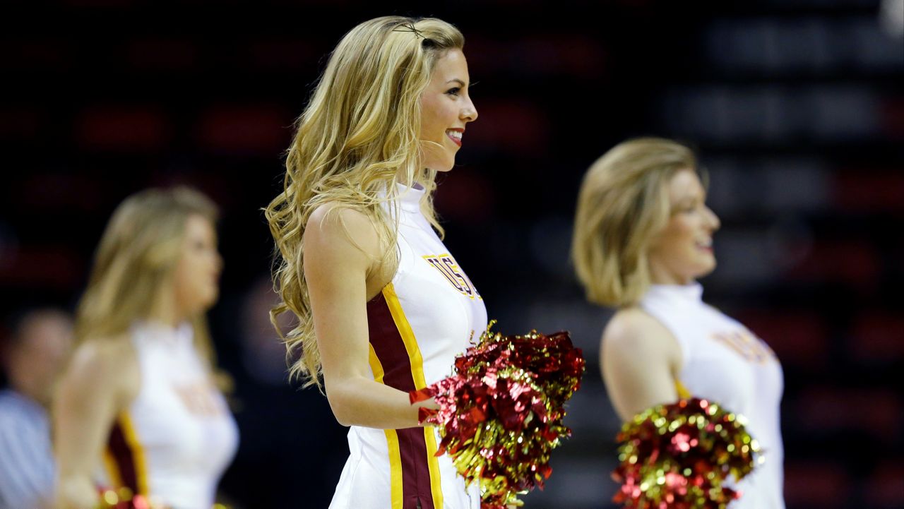 The USC Southern California Song Girls cheerleaders perform in the second half of an NCAA college basketball game between USC and Arizona in the Pac-12 women's tournament, Thursday, March 6, 2014, in Seattle. (AP Photo/Ted S. Warren)