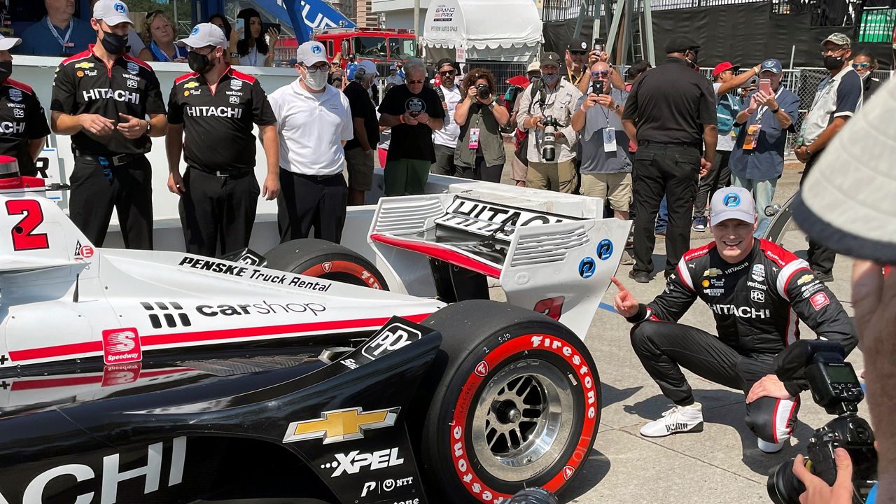 American driver Josef Newgarden celebrates Saturday after winning the pole for the Grand Prix of Long Beach in Long Beach, Calif. (AP Photo/Jenna Fryer)