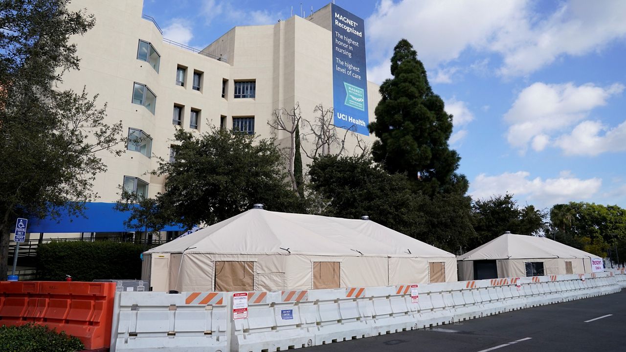 Medical tents are set up outside the emergency room at UCI Medical Center in Irvine, Calif. on Dec. 17, 2021. (AP Photo/Ashley Landis)