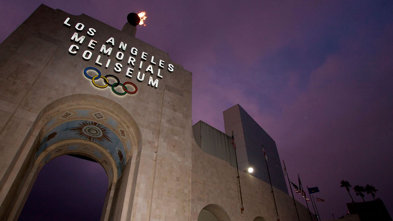 The Los Angeles Memorial Coliseum is seen in Los Angeles. The new rules will be in effect at Saturday's USC football game against Utah at the Coliseum. (AP Photo/Damian Dovarganes)
