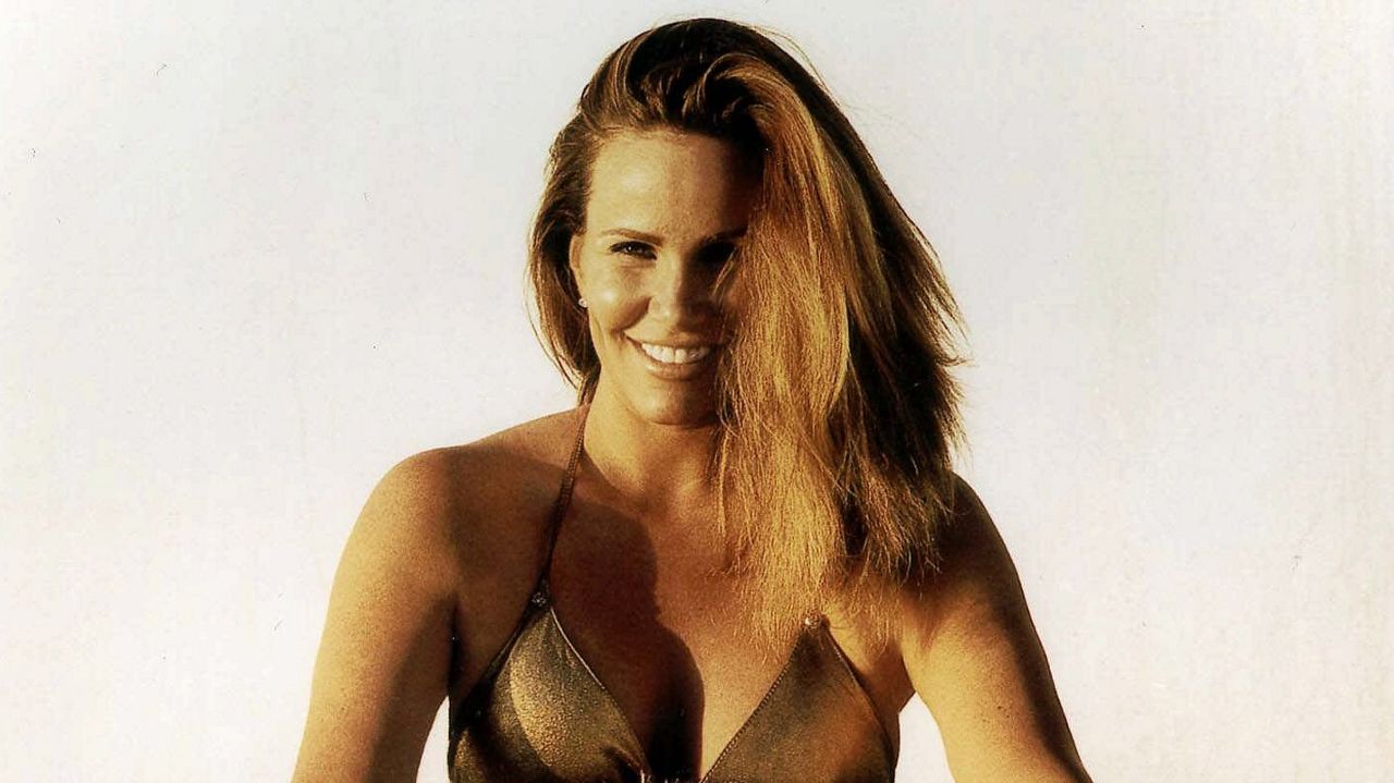 This file photo originally supplied by Sports Illustrated shows actress Tawny Kitaen, in the Sports Illustrated Swimsuit edition that came out Feb. 10, 1999.  (AP Photo/Sports Illustrated )