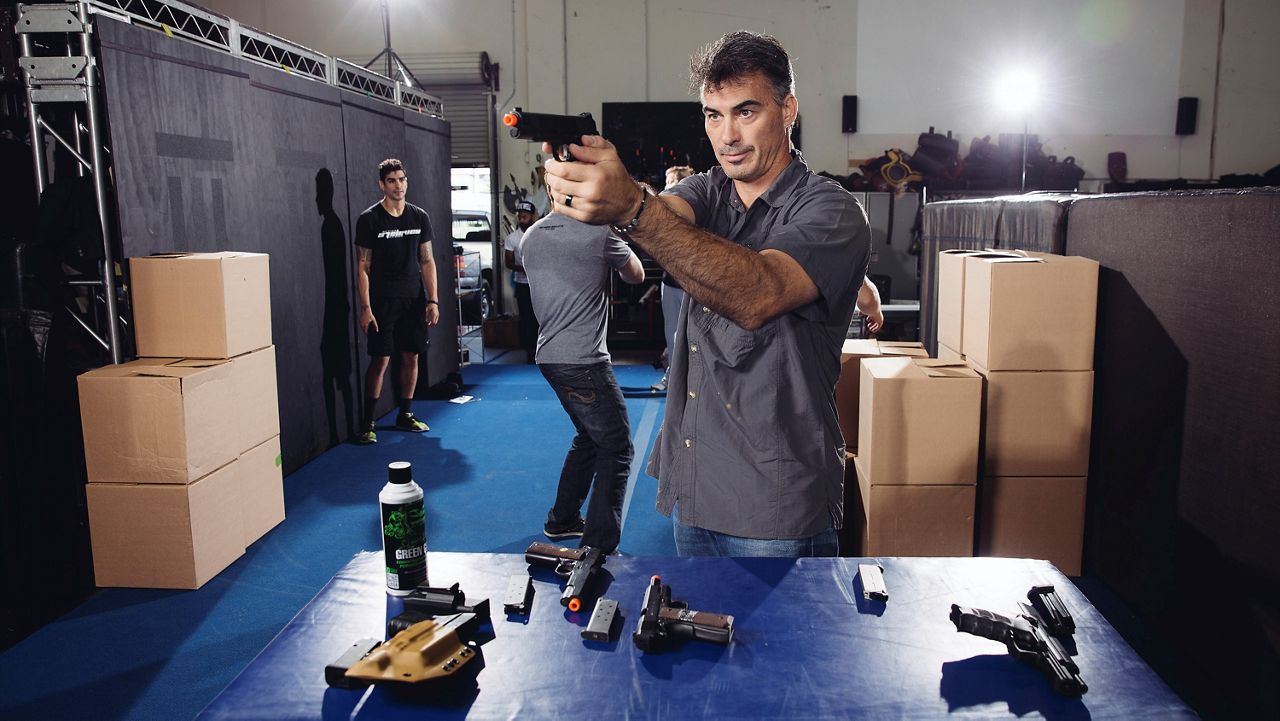 In this Oct. 7, 2014, file photo, Chad Stahelski, co-director of the film, "John Wick," demonstrates proper gun handling during a training session at 87Eleven Action Design in Inglewood, Calif. (Photo by Casey Curry/Invision/AP)