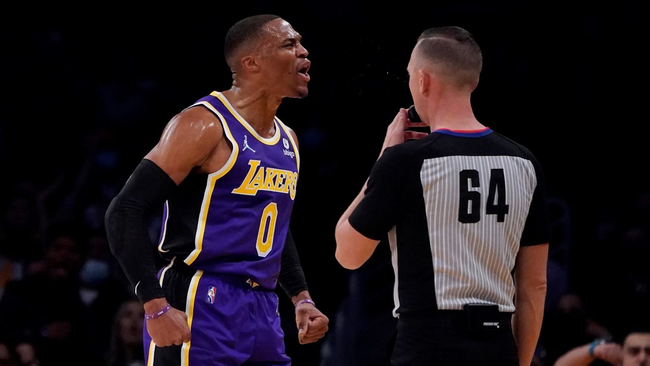 Los Angeles Lakers guard Russell Westbrook, left, reacts after scoring during the first half of an NBA basketball game Friday against the Phoenix Suns in Los Angeles. (AP Photo/Marcio Jose Sanchez)