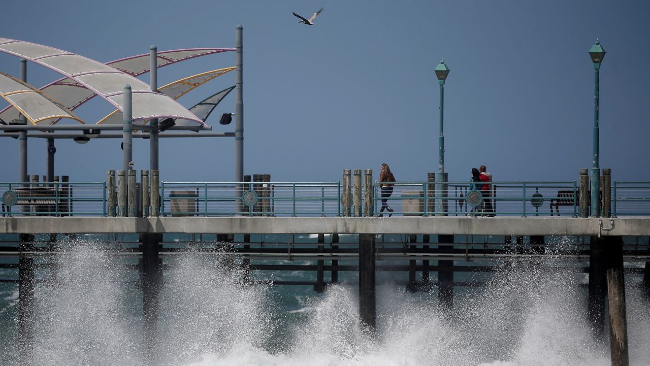 In this April 8, 2013, file photo, waves hit the Redondo Beach Pier in Redondo Beach, Calif. (AP Photo/Jae C. Hong)
