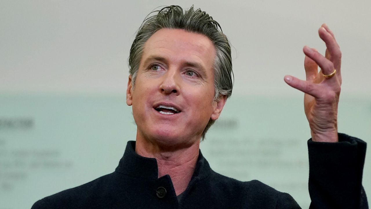 Gov. Gavin Newsom speaks at a news conference in Oakland, Calif., on Oct. 27, 2021. After abruptly canceling his plans last week to attend the United Nations climate summit in Scotland, Newsom did not participate in the conference virtually the first week of November 2021 while attending to unspecified family obligations. (AP Photo/Jeff Chiu)