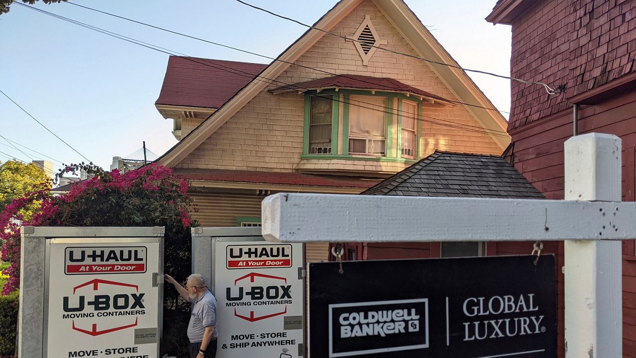 In this March 5, 2021, file photo, property owner Gil Jaffe gets ready to leave California after selling his single-family house in the Echo Park neighborhood of Los Angeles. (AP Photo/Damian Dovarganes)