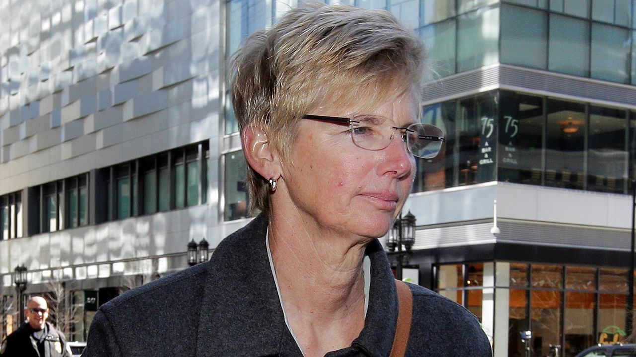 In this March 25, 2019, file photo, Donna Heinel, former University of Southern California athletics administrator, arrives at federal court in Boston to face charges in a nationwide college admissions bribery scandal. Heinel, who's charged with accepting bribes to get kids into USC, is among several fighting allegations in the case and will be going to trial in 2021. (AP Photo/Steven Senne)
