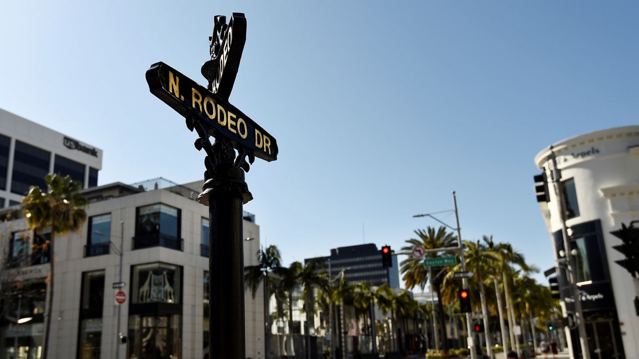 This March 30, 2020, file photo shows a deserted Rodeo Drive in Beverly Hills, Calif. (AP Photo/Chris Pizzello)