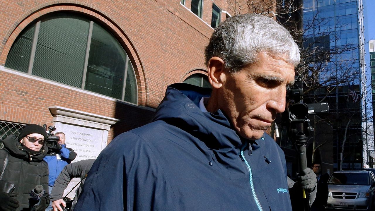 In this March 12, 2019, file photo, William "Rick" Singer founder of the Edge College & Career Network, departs federal court in Boston after he pleaded guilty to charges in a nationwide college admissions bribery scandal. (AP Photo/Steven Senne)