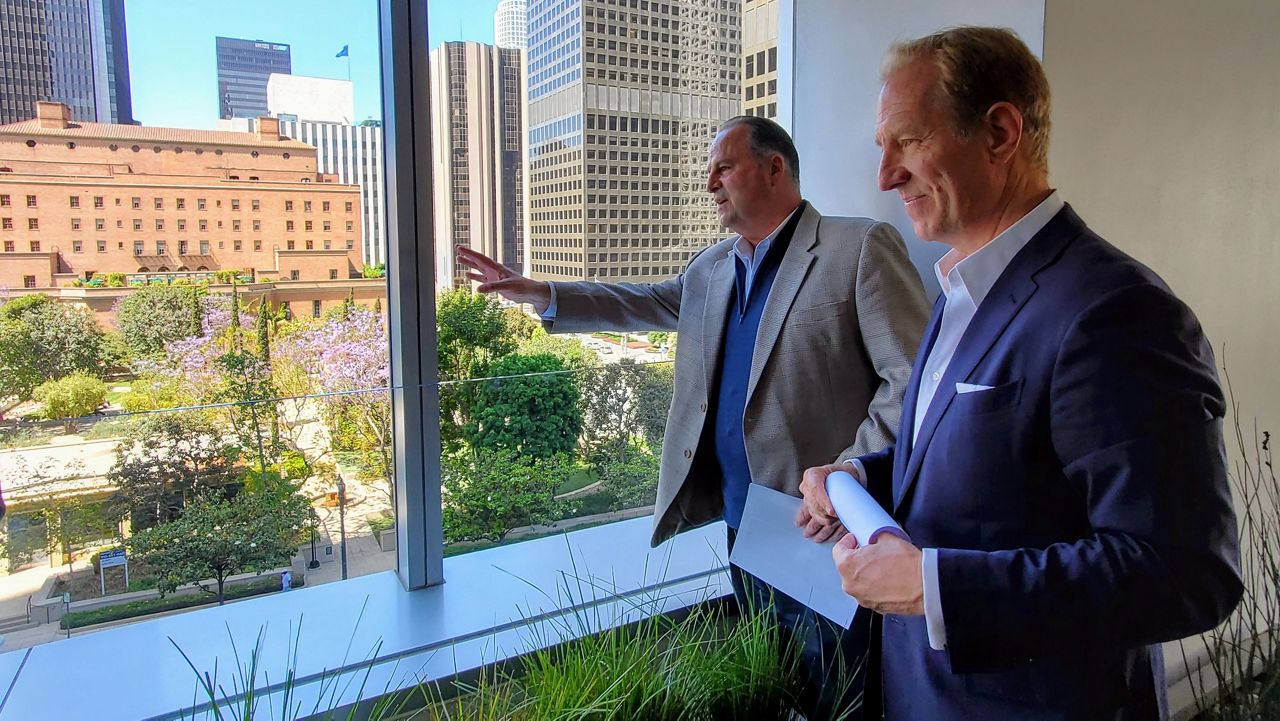 Coretrust Capital Partners Tom Ricci and John Sischo looks outside the FourFortyFour building's new open air terrace on the sixth floor (Spectrum News/ Joseph Pimentel)