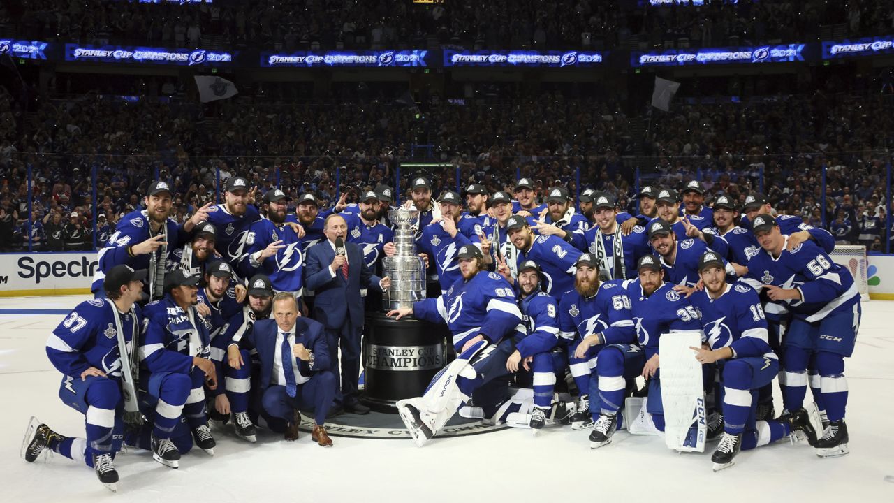 he Tampa Bay Lightning pose with the Stanley Cup after defeating the Montreal Canadiens 1-0 in Game 5 to win the NHL hockey Stanley Cup Finals, Wednesday, July 7, 2021, in Tampa, Fla. (Bruce Bennett/Pool Photo via AP)