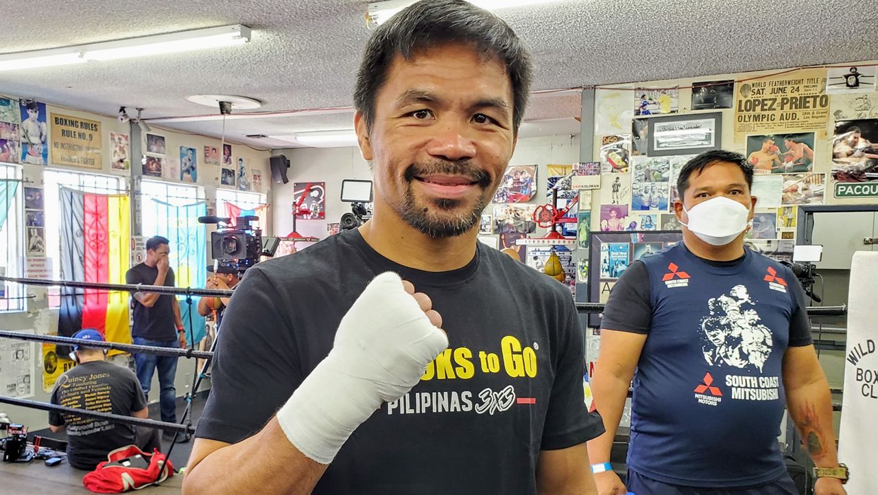 Filipino boxer Manny Pacquiao poses in front of a camera during a media day workout at the Wildcard Boxing Club in Los Angeles (Spectrum News/Joseph Pimentel)