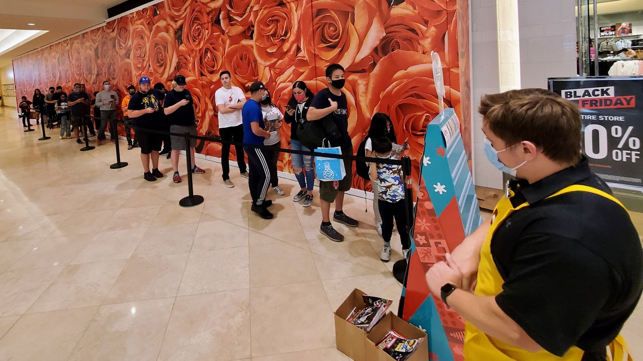 Black Friday shoppers wait in line to get inside the Lego store at South Coast Plaza. (Spectrum News/Joseph Pimentel)