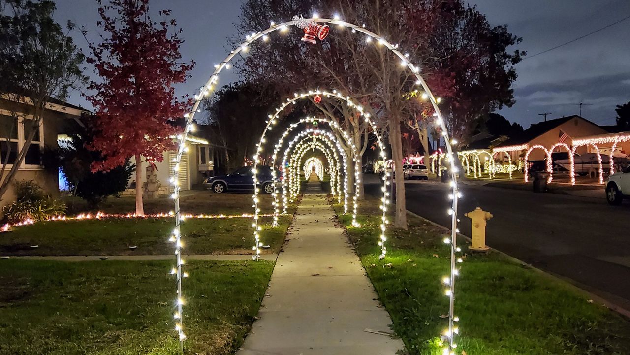 Lighted holiday archways line the 6700 Block of Parapet Street in Long Beach. (Spectrum News/Joseph Pimentel)