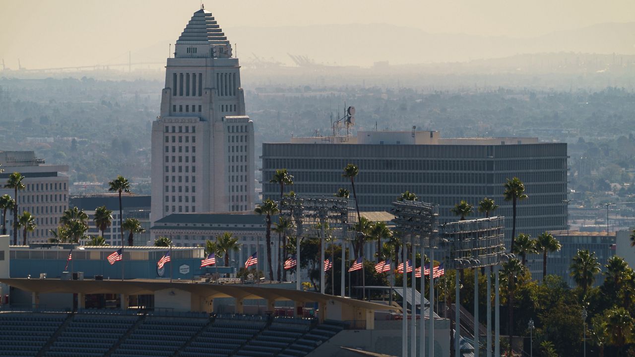 This Jan. 11, 2021, file photo shows Los Angeles City Hall from Dodgers Stadium. (AP Photo/Damian Dovarganes)