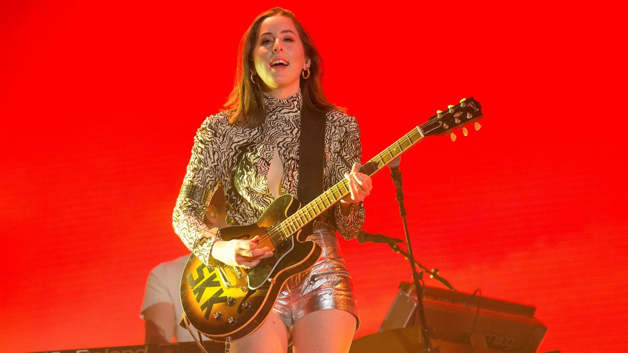 In this April 14, 2018, file photo, Alana Haim of HAIM performs at the Coachella Music & Arts Festival in Indio, Calif. Haim stars in the Paul Thomas Anderson film "Licorice Pizza." (Photo by Amy Harris/Invision/AP)