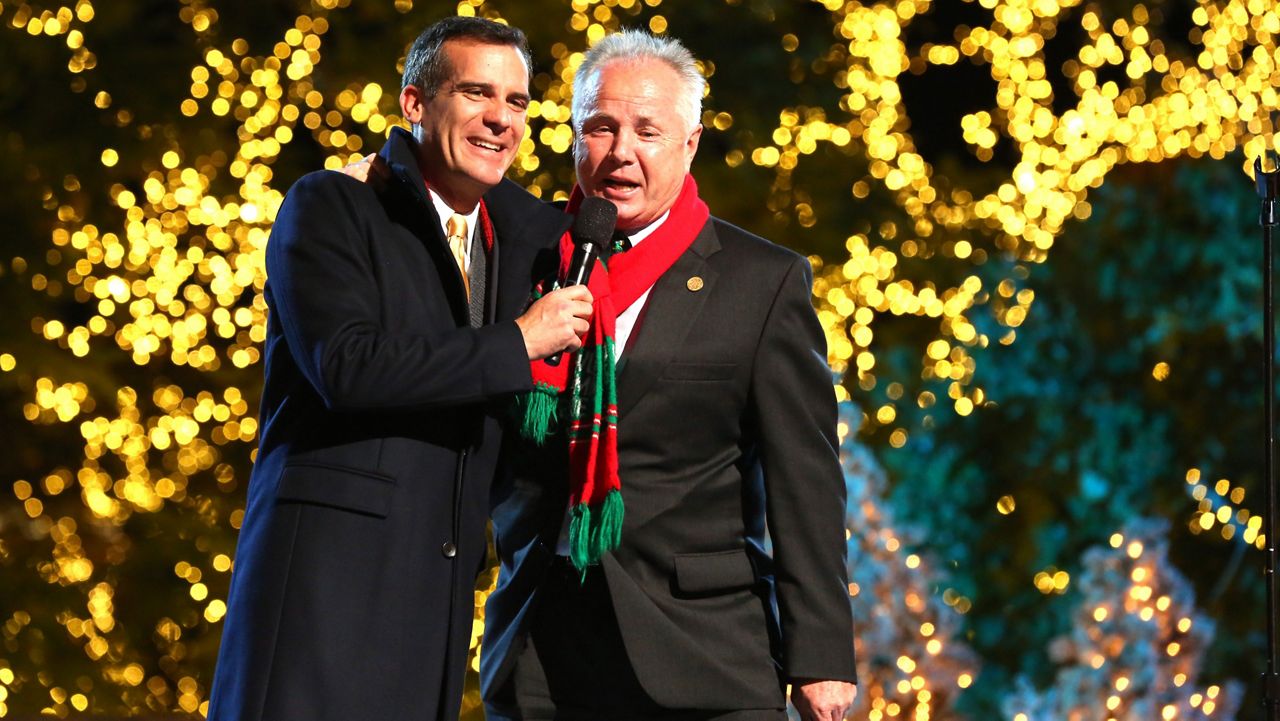 Mayor Eric Garcetti and Councilman Tom LaBonge at The Grove's 11th Annual Christmas Tree Lighting Spectacular Presented By Citi at The Grove on Nov. 17, 2013, in Los Angeles, California. (Photo by Alexandra Wyman/Invision for Caruso Affiliated/AP Images)