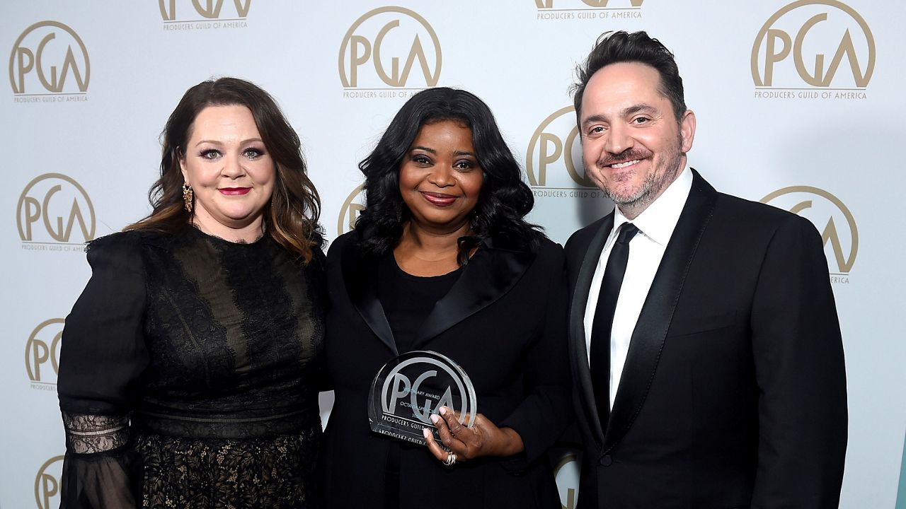 In this Jan. 18, 2020, file photo, Melissa McCarthy, Octavia Spencer, winner of the Visionary Award, and Ben Falcone attend the 31st annual Producers Guild Awards at the Hollywood Palladium in Los Angeles. (Photo by Jordan Strauss/Invision for the Producers Guild of America/AP Images)