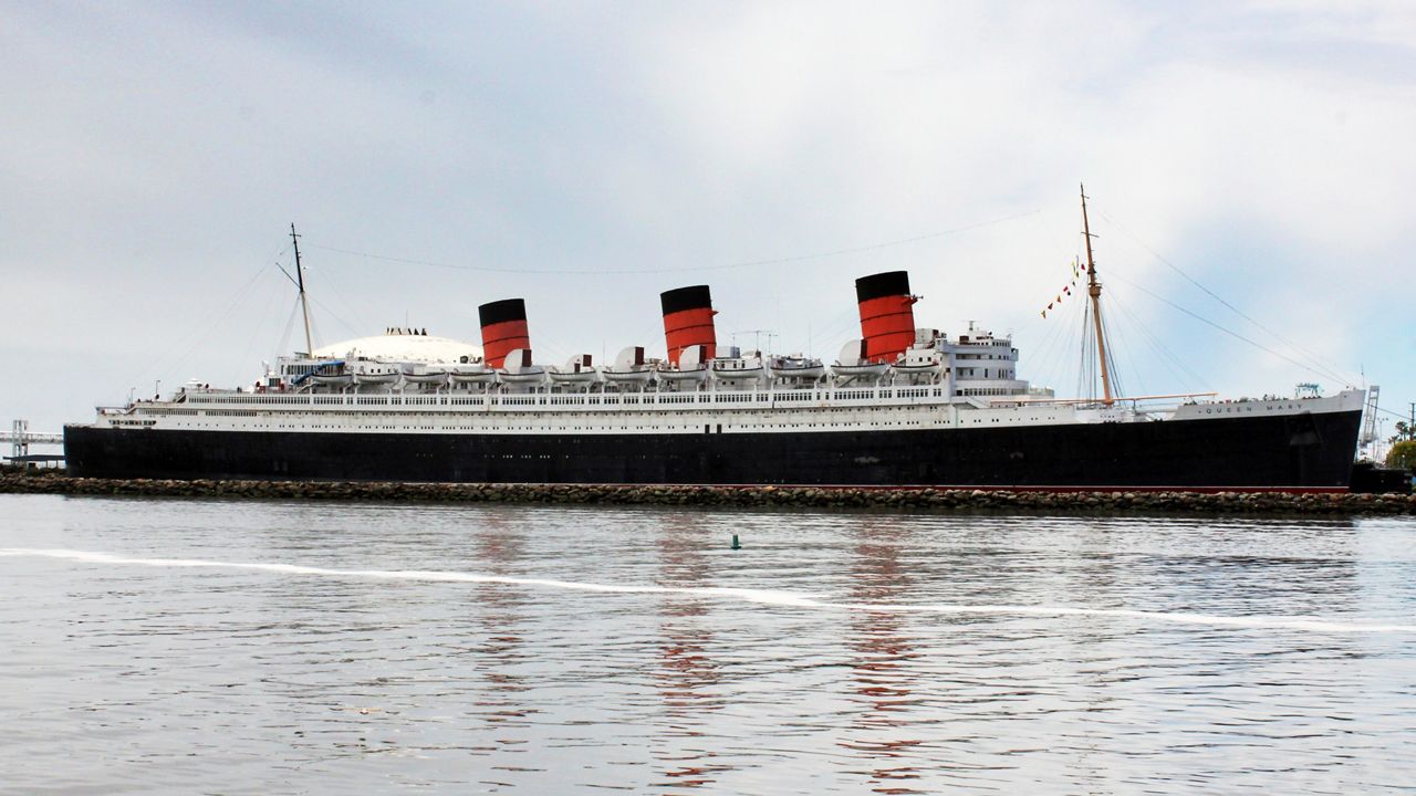 In this May 15, 2015, file photo, the retired Cunard ocean liner Queen Mary, is seen at its permanent mooring in the harbor at Long Beach, Calif. (AP Photo/John Antczak)
