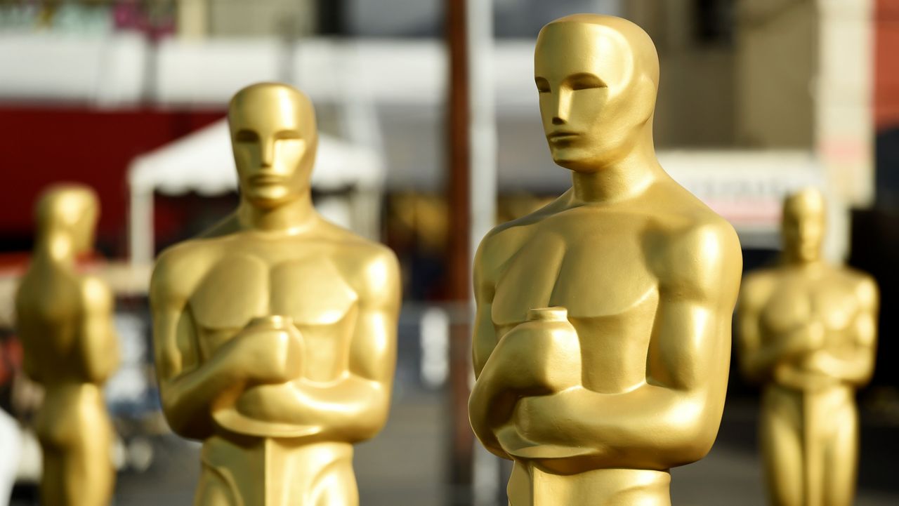 In this Feb. 5, 2020, file photo, Oscar statues stand off of Hollywood Boulevard in preparation for the 92nd Academy Awards at the Dolby Theatre in Los Angeles. (AP Photo/Chris Pizzello)
