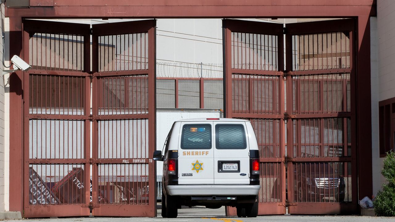 In this April 1, 2020, file photo, a Los Angeles County Sheriff’s Department van enters the Twin Towers Correctional Facility in Los Angeles. (AP Photo/Damian Dovarganes)