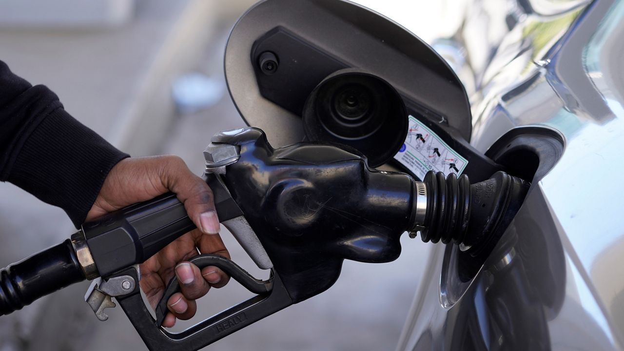 A motorist pumps gasoline at a Mobil gas station on Feb. 25, 2022, following Russia’s invasion of Ukraine, in West Hollywood, Calif. (AP Photo/Damian Dovarganes)