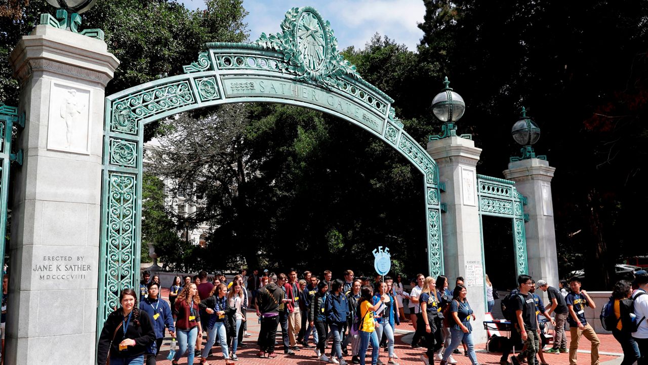 In this Aug. 15, 2017, file photo, students walk on the University of California, Berkeley campus in Berkeley, Calif. (AP Photo/Marcio Jose Sanchez)