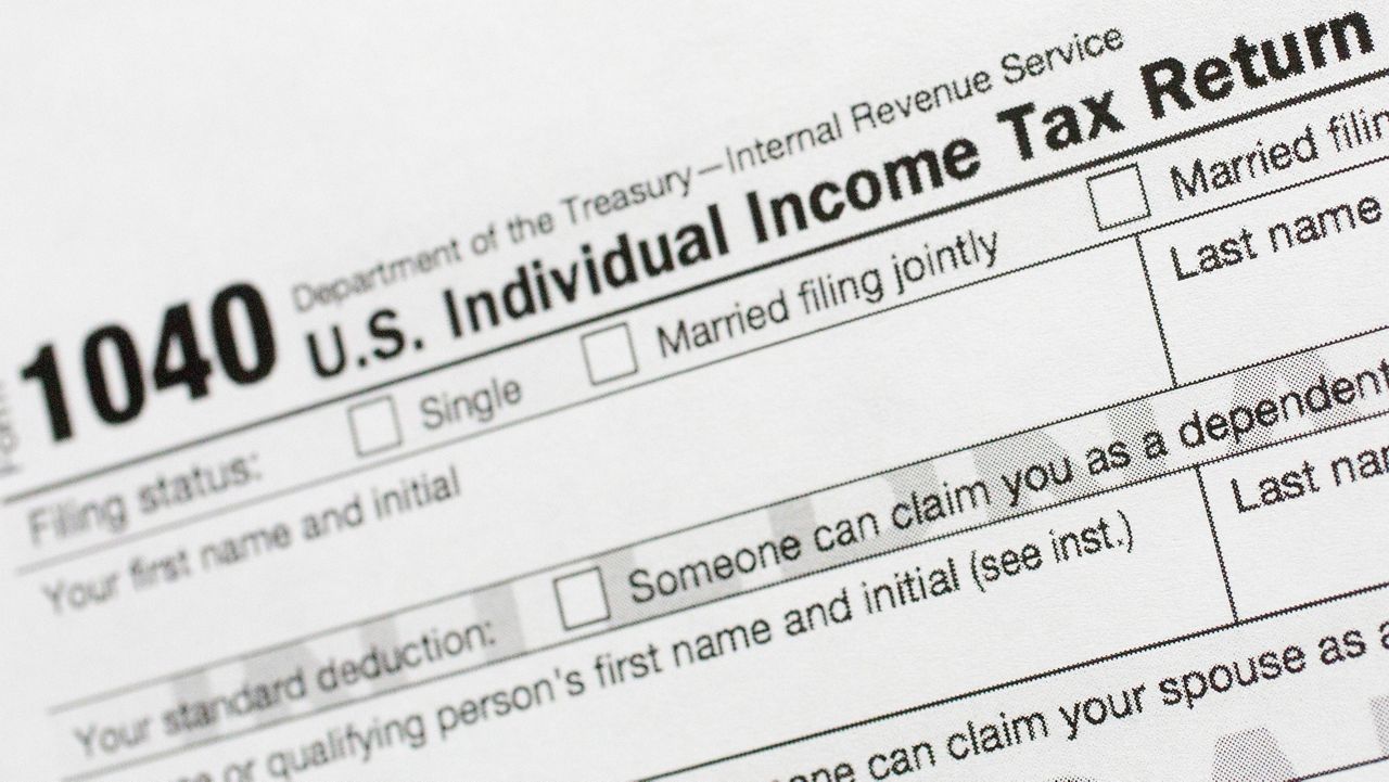 This July 24, 2018, file photo shows a portion of the 1040 U.S. Individual Income Tax Return form. (AP Photo/Mark Lennihan)