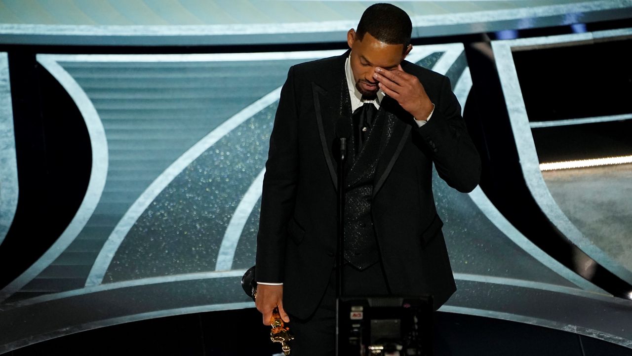 Will Smith wipes away tears during his acceptance speech for Best Actor at the Oscars on March 27, 2022, at the Dolby Theatre in Los Angeles. (AP Photo/Chris Pizzello)