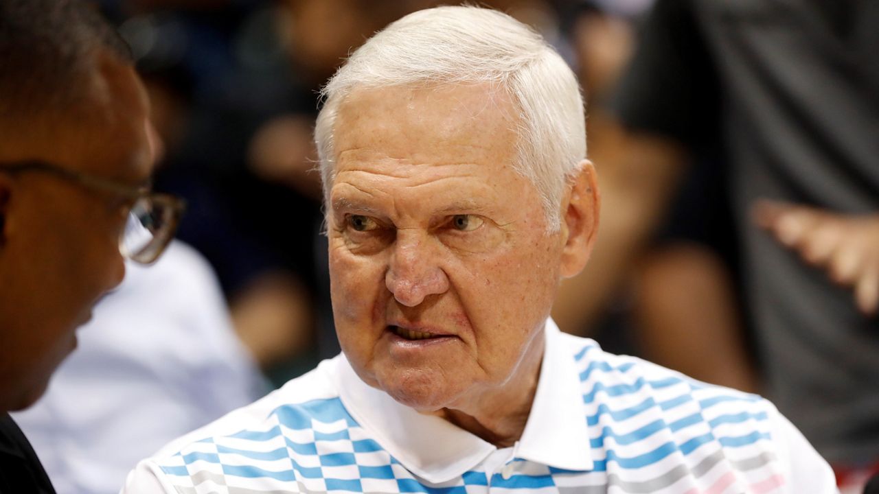 NBA legend Jerry West is seen on the sidelines before an NBA preseason basketball game on Oct. 3, 2019, between the Houston Rockets and the Los Angeles Clippers in Honolulu. (AP Photo/Marco Garcia)