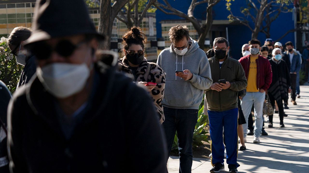 People wait in line for a COVID-19 test in Los Angeles on Jan. 4, 2022.  (AP Photo/Jae C. Hong)