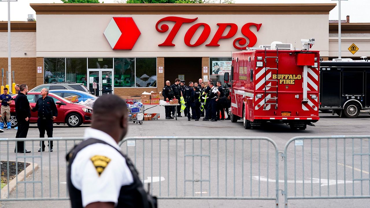 Investigators work the scene of a shooting at a supermarket, in Buffalo, N.Y., Monday, May 16, 2022. (AP Photo/Matt Rourke)