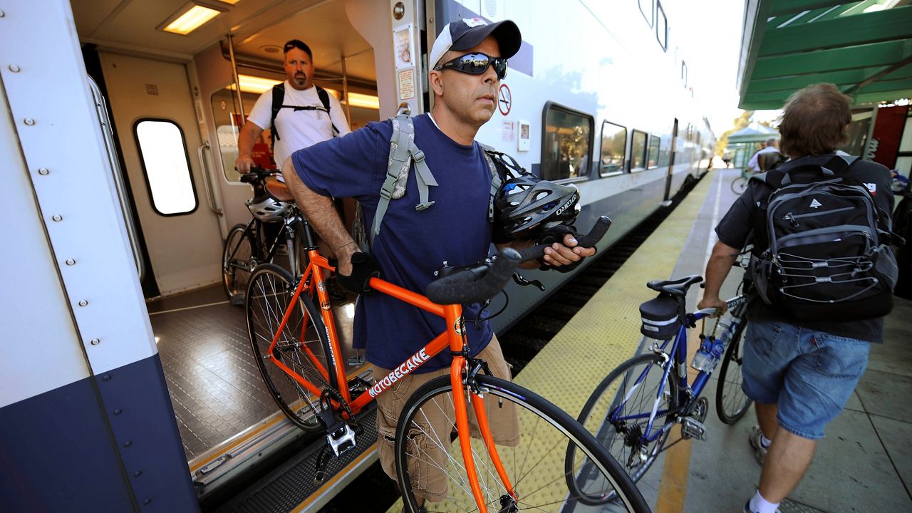 Jerry Romero gets off the Metrolink commuter train at the Simi Valley, Calif, train station with fellow riders on Sept. 18, 2008. (AP Photo/Kevork Djansezian)