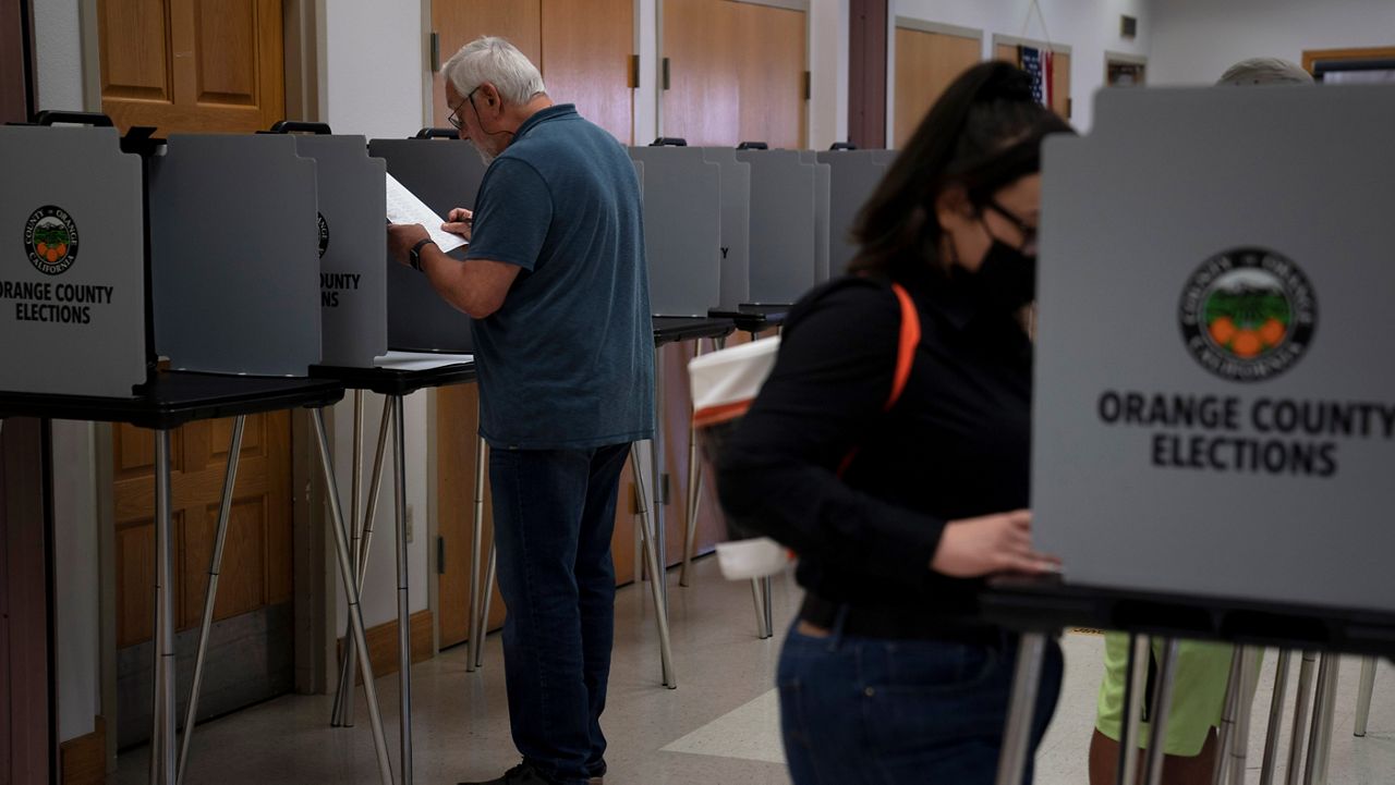 In this Sept. 14, 2021, file photo, voters cast their ballots at a voting center in the Orange County city of La Habra, Calif. (AP Photo/Jae C. Hong, File)