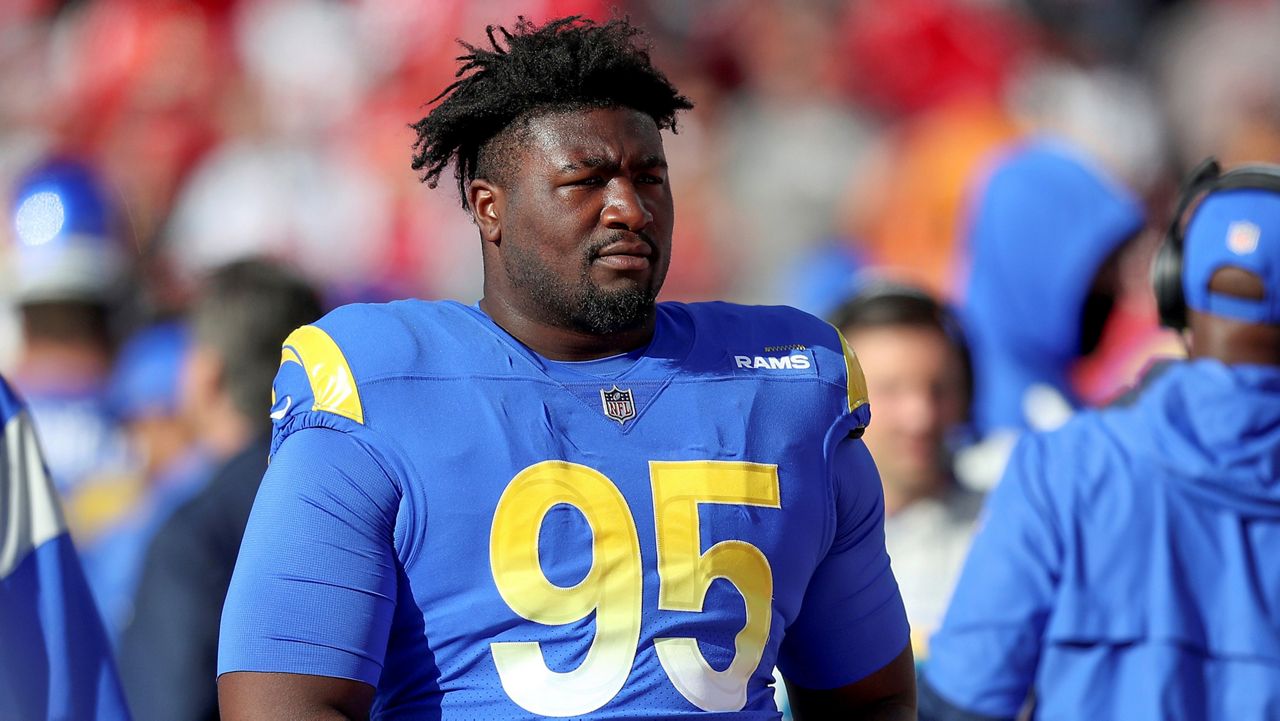 Los Angeles Rams defensive tackle Bobby Brown III (95) watches the action from the sideline during a NFL divisional playoff football game between the Los Angeles Rams and Tampa Bay Buccaneers on Jan. 23, 2022 in Tampa, Florida. (AP Photo/Alex Menendez)