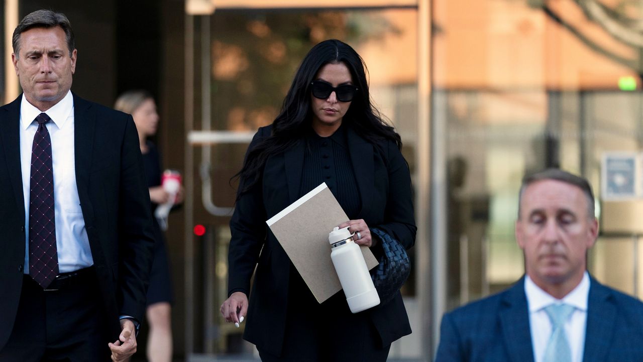 Vanessa Bryant, center, the widow of Kobe Bryant, leaves a federal courthouse on Aug. 10, 2022, in Los Angeles. (AP Photo/Jae C. Hong)