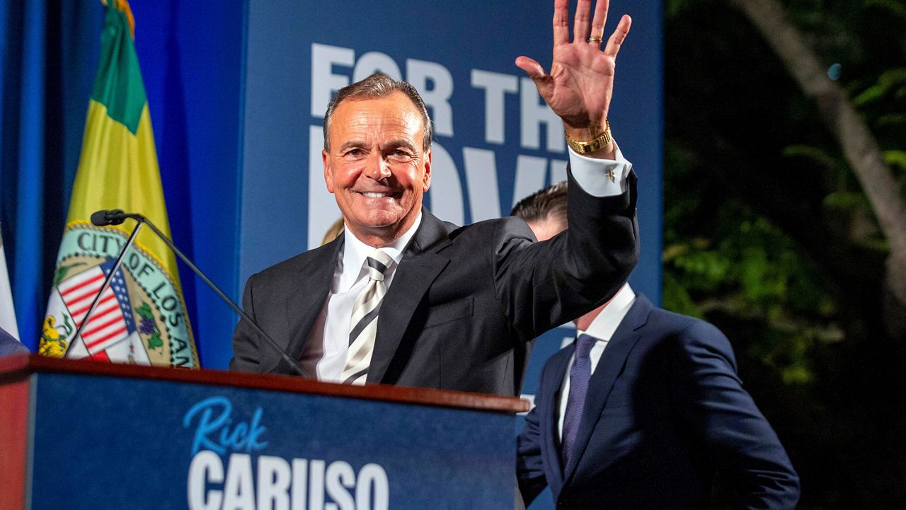 Rick Caruso, a Democratic candidate for mayor of Los Angeles, waves to supporters attending a primary election campaign event on June 7, 2022, in Los Angeles. Republican-turned Democrat billionaire developer Caruso will face Democratic U.S. Rep Karen Bass in the race for Los Angeles mayor. (AP Photo/Alex Gallardo)