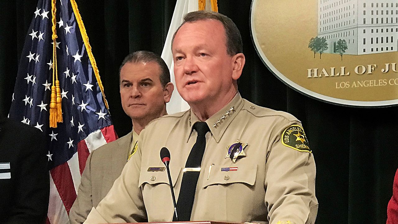 Los Angeles County Sheriff Jim McDonnell talks to reporters about the case of a 10-year-old boy who died after suffering head injuries, and previously claimed he was beaten, locked up and not fed, at a news conference on June 27, 2018, at the Hall of Justice in Los Angeles. (AP Photo/Michael Balsamo)