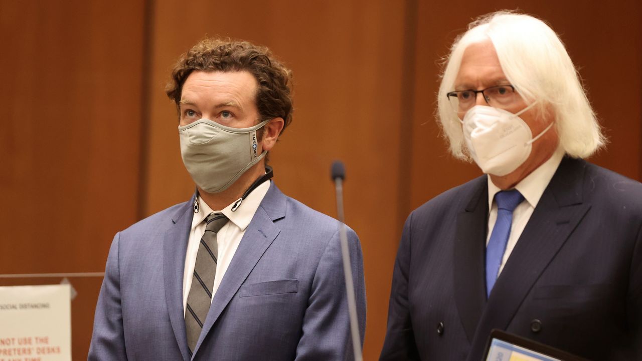 Actor Danny Masterson, left, stands with his attorney, Thomas Mesereau as he is arraigned on rape charges at Los Angeles Superior Court on Sept. 18, 2020, in Los Angeles, Calif. (Lucy Nicholson/Pool Photo via AP)