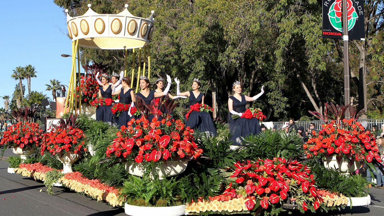 The float with the Tournament of Roses queen and court float moves down Colorado Boulevard in the 126th Rose Parade on Jan., 1, 2015, in Pasadena, Calif. (AP Photo/Ringo H.W. Chiu)