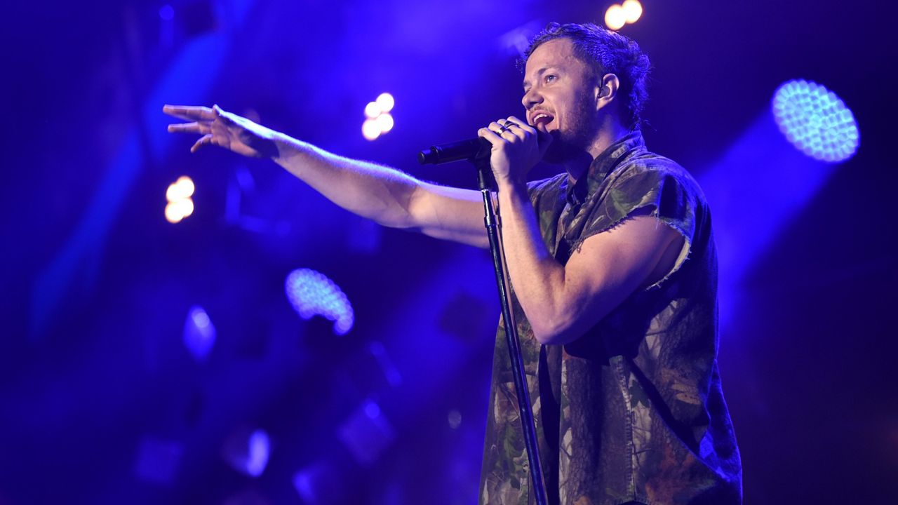 Dan Reynolds, of Imagine Dragons, performs at the 25th annual KROQ Almost Acoustic Christmas at The Forum on Dec. 14, 2014, in Inglewood, Calif. (Photo by John Shearer/Invision/AP)