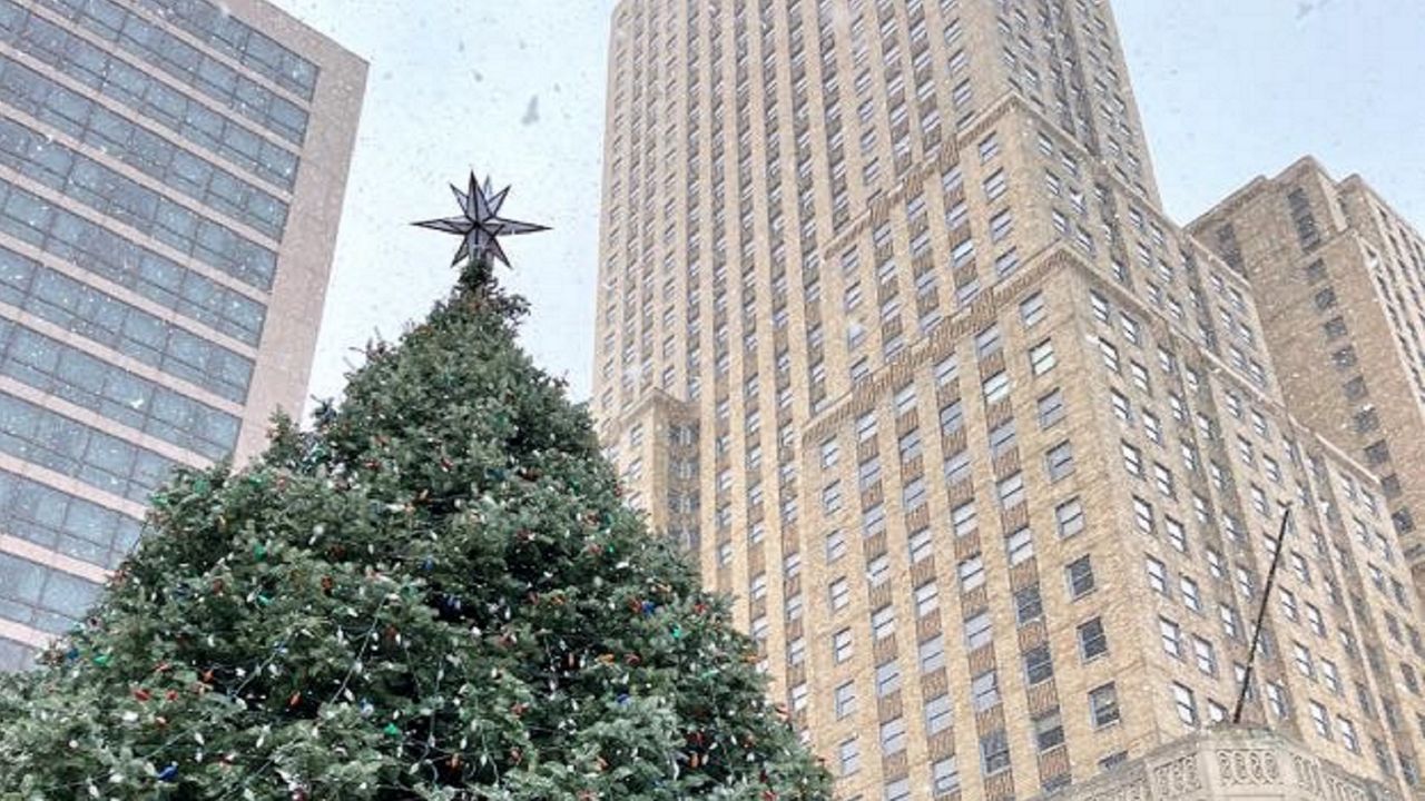 This year's holiday tree at Fountain Square features a new star created by a local metalworker. (Casey Weldon/Spectrum News 1)