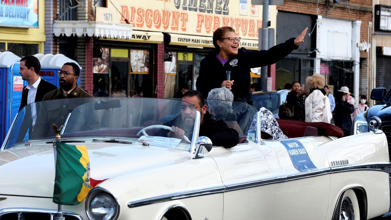 Newly elected Los Angeles Mayor Karen Bass waves as she rides along during the Kingdom Day Parade in Los Angeles on Jan. 16, 2023. (AP Photo/Richard Vogel)