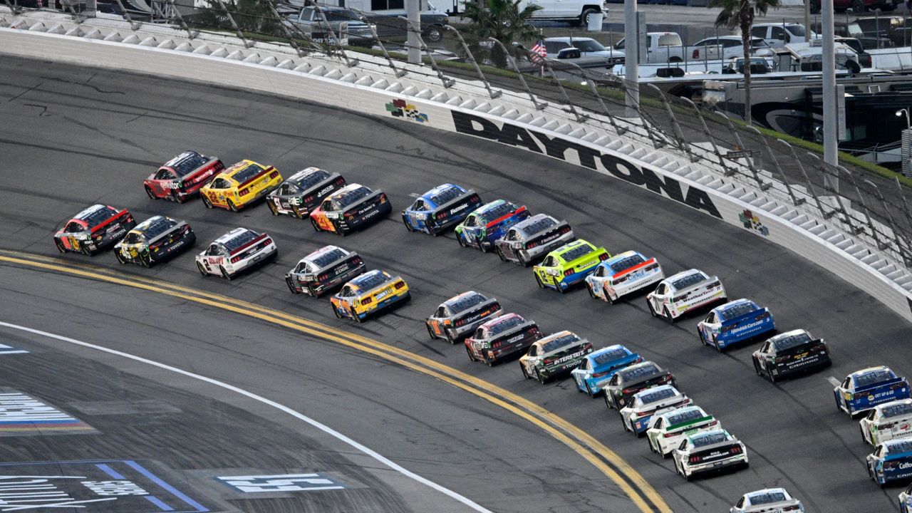 The field for the 2024 Daytona 500 drives through Turn 1 at Daytona International Speedway on Feb. 19. (AP Photo/Phelan M. Ebenhack)