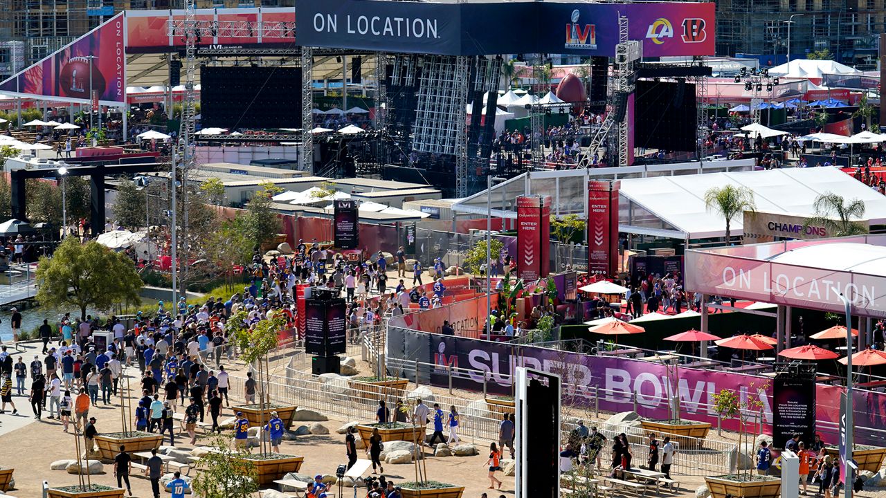 Fans arrive before the NFL Super Bowl 56 football game between the Los Angeles Rams and the Cincinnati Bengals Sunday, Feb. 13, 2022, in Inglewood, Calif. (AP Photo/Tony Gutierrez)
