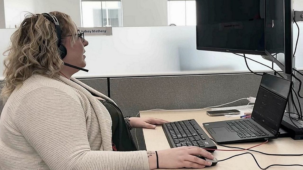 211 Helpline Coordinator Lindsey Matheny helps a caller with housing assistance (Camri Nelson)