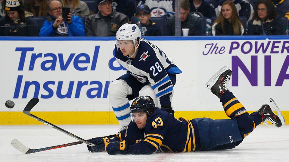 Buffalo Sabres forward Conor Sheary (43) reaches for the puck in front of Winnipeg Jets forward Jack Roslovic (28) on Sunday, Feb. 10, 2019, in Buffalo N.Y. (AP File Photo/Jeffrey T. Barnes)