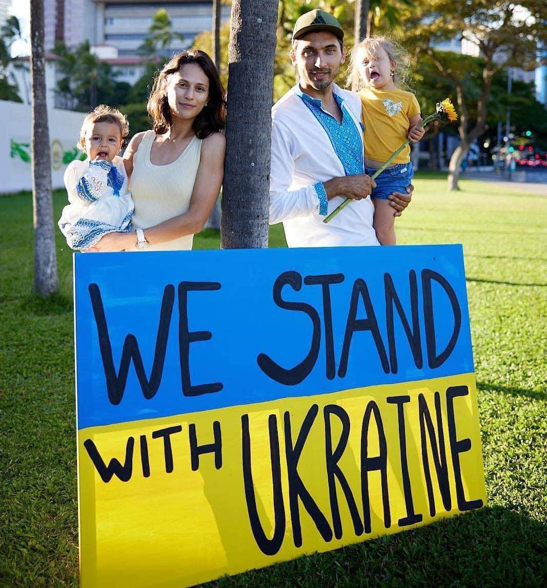 A family at a rally at Ala Moana Beach Park on Feb. 27. (Courtesy Elena Roud)