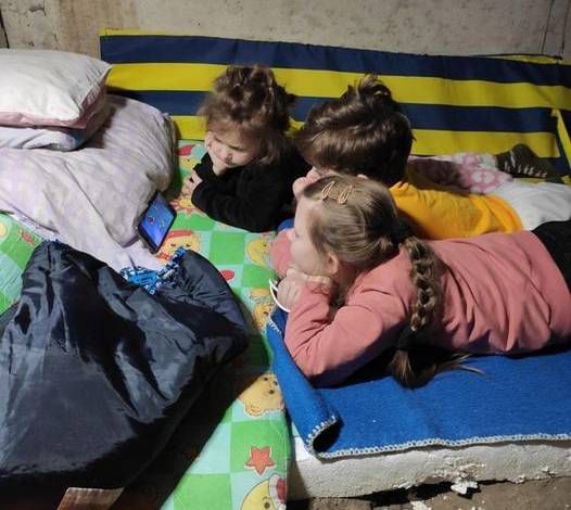 A photo Anastasia sent of her children and a friend hiding in a bomb shelter. (Courtesy: Oksana Enriquez Klyuchnichenko)